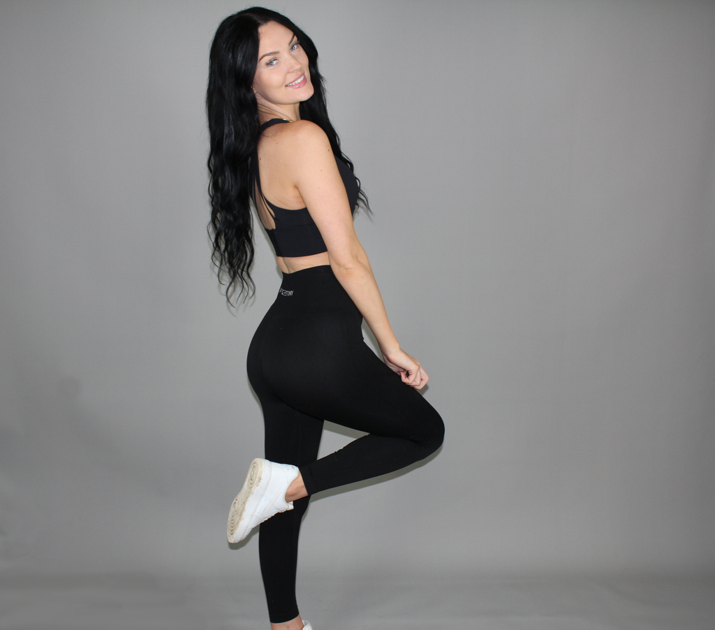 Model smiling for camera. Seamless Black Leggings
